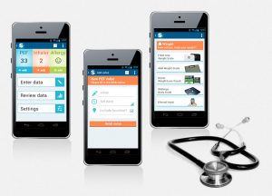 Three mobiles with health and medical apps displayed on them and a stethescope placed beside them.