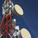 Low angle shot of a telecom tower with the sky background.