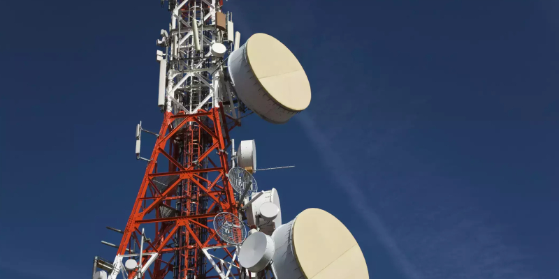 Low angle shot of a telecom tower with the sky background.